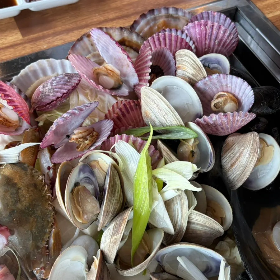 Steamed clams and octopus starting to boil