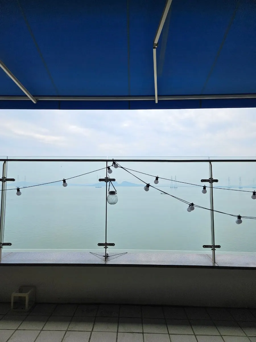 Dining table with a sea view through the window