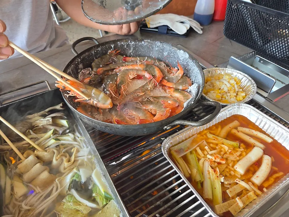 Seasonal shrimp cooking with the lid open