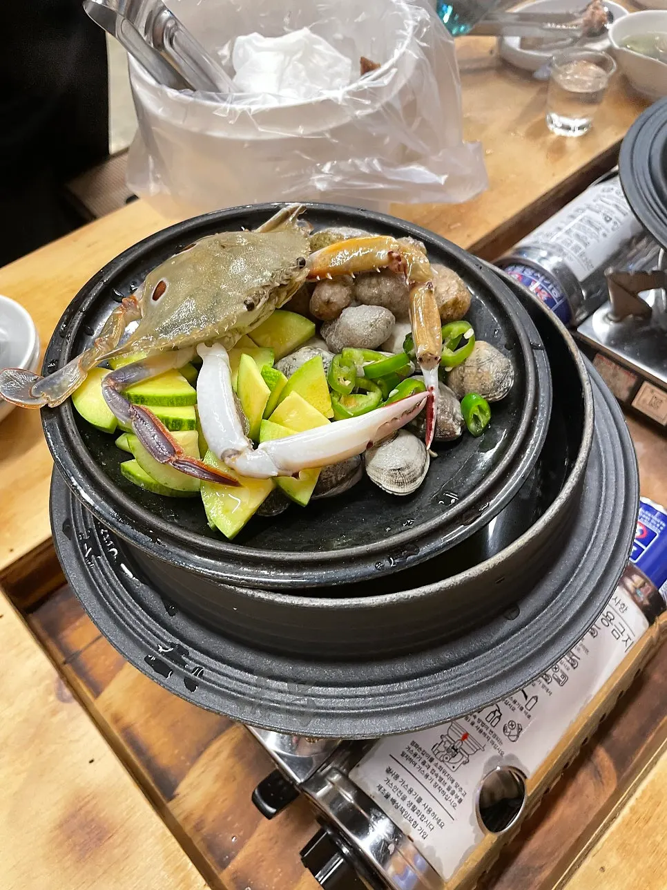 Cauldron seafood hand-torn noodle soup with a whole crab