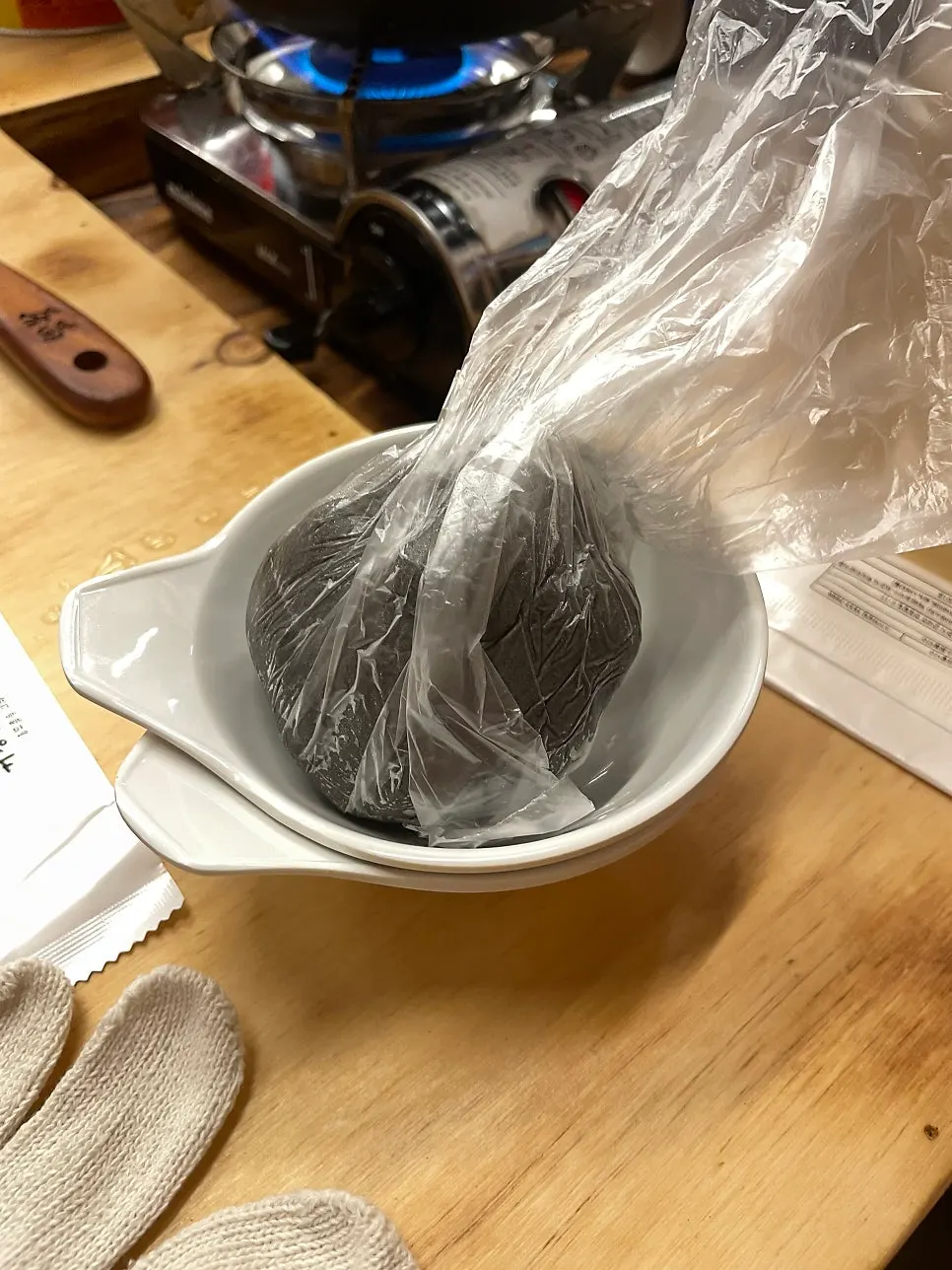 Tearing noodle dough into the cauldron