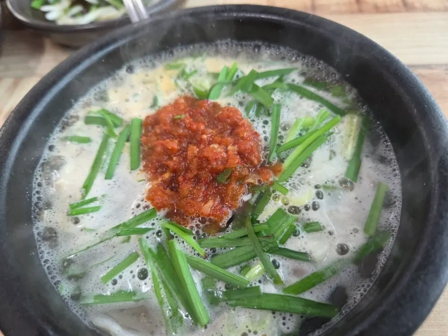 A full spread of intestine gukbap at Bongga Gukbap in Geoje