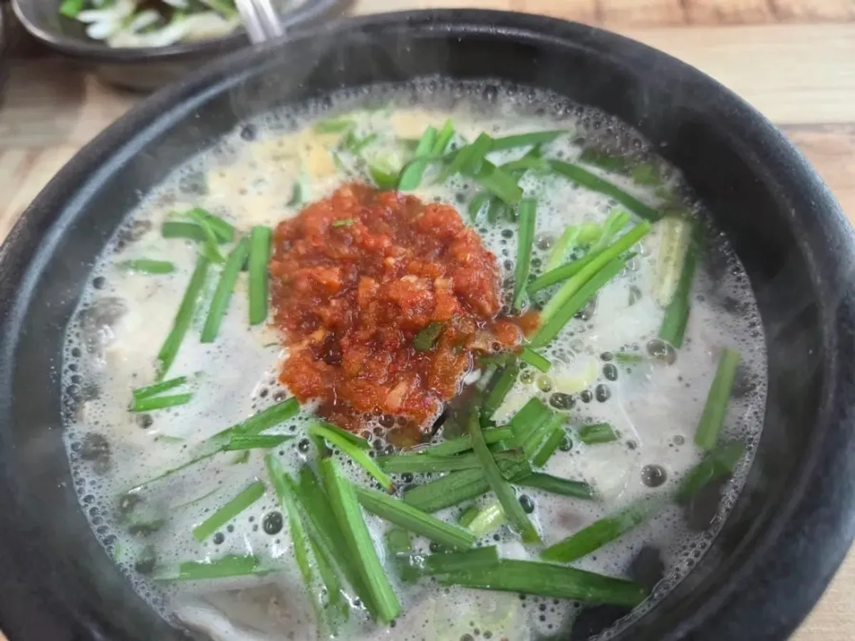 A steaming bowl of intestine gukbap