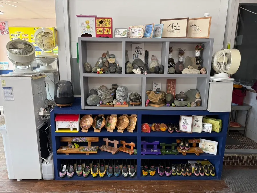 Display of viewing stones and hand-painted rubber shoes