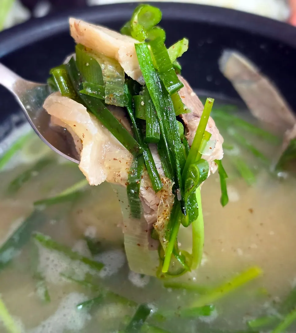 Kid-friendly pork gukbap served with a baby spoon