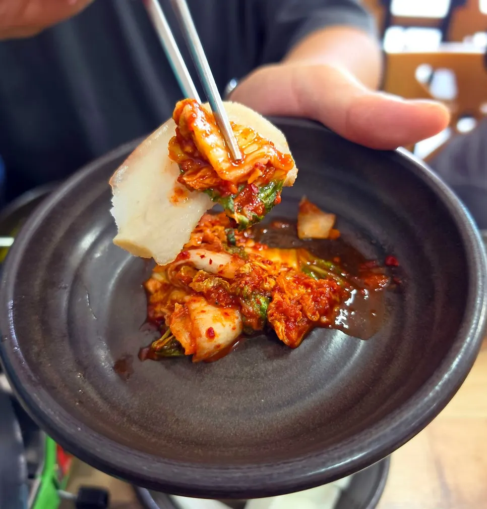 Kimchi and salted shrimp served with suyuk