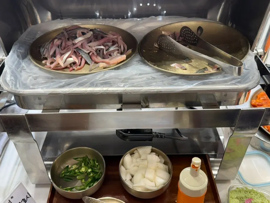 Rows of side dishes lined up at the self-serve bar