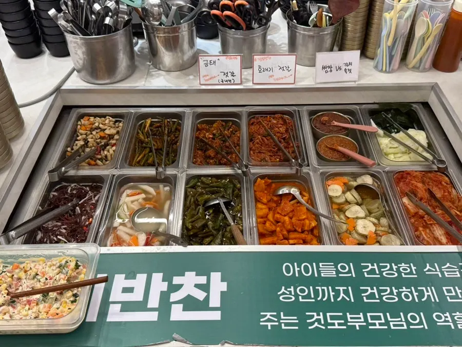 Baby chair and baby utensils set up beside the self-serve bar