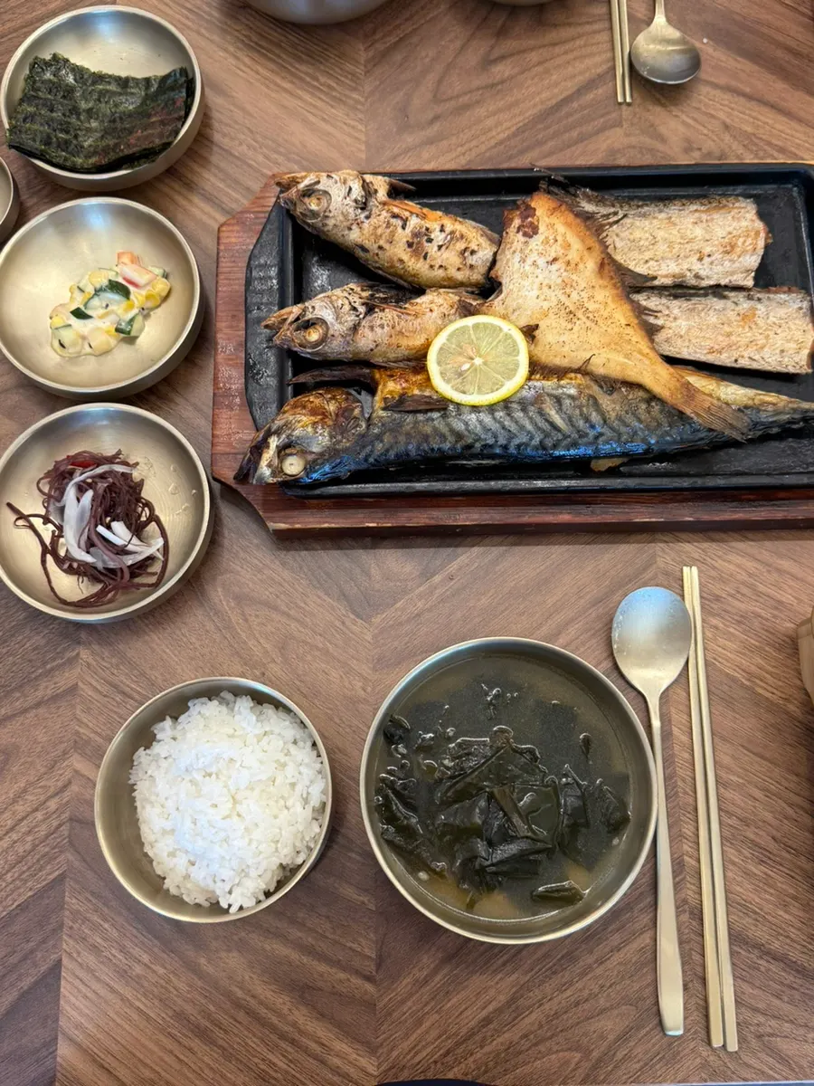 Full table spread with self-serve side dishes and the prawn jang added