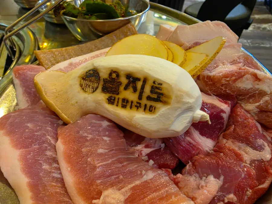 A geun platter with pork belly and pork jowl