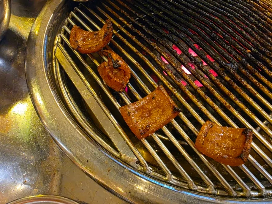 Charcoal-grilled meat table setting