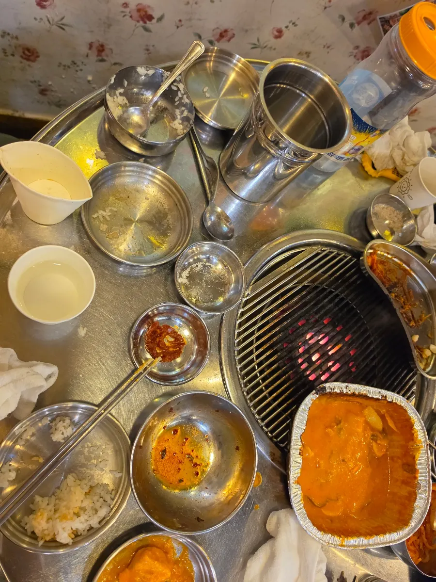 Family dinner table cleared down to the side dishes