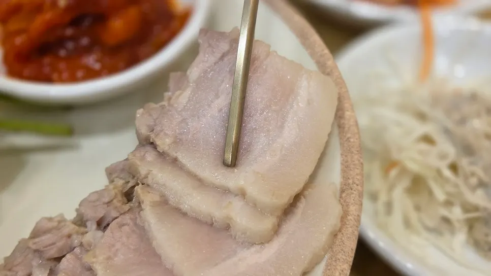 Bossam served with boiled pork and dried radish