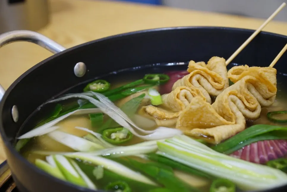Kalguksu noodles added to the leftover clam soup broth