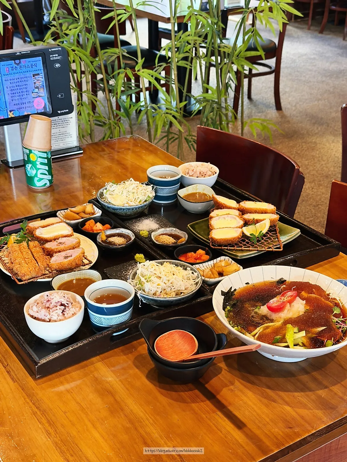 Vertical photo of a full pork cutlet spread at Gyeomson Donkatsu Geomdan Branch