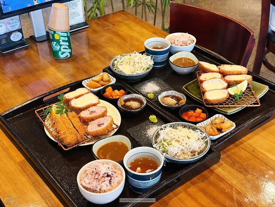 Pork cutlet meal set with rice, soup, curry, and side dishes
