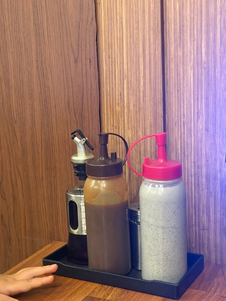 Sauces and salt set out on the table