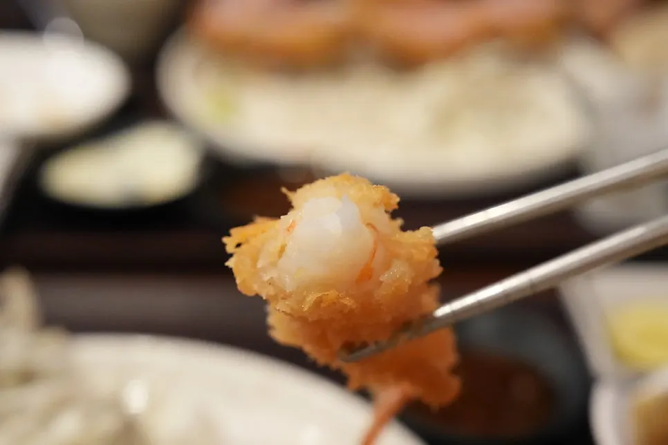 Inside of the shrimp tempura showing its springy texture