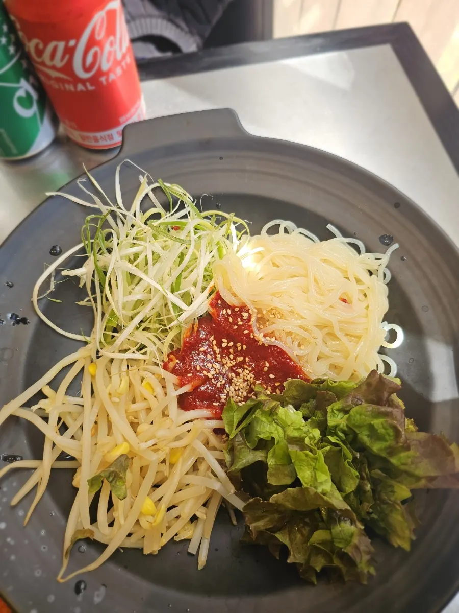 Mixing sweet-and-tangy bibim jjolmyeon
