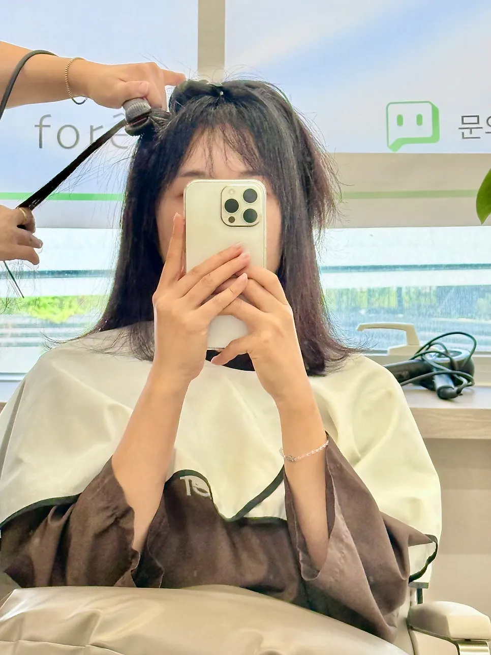 Hair during root straightening treatment