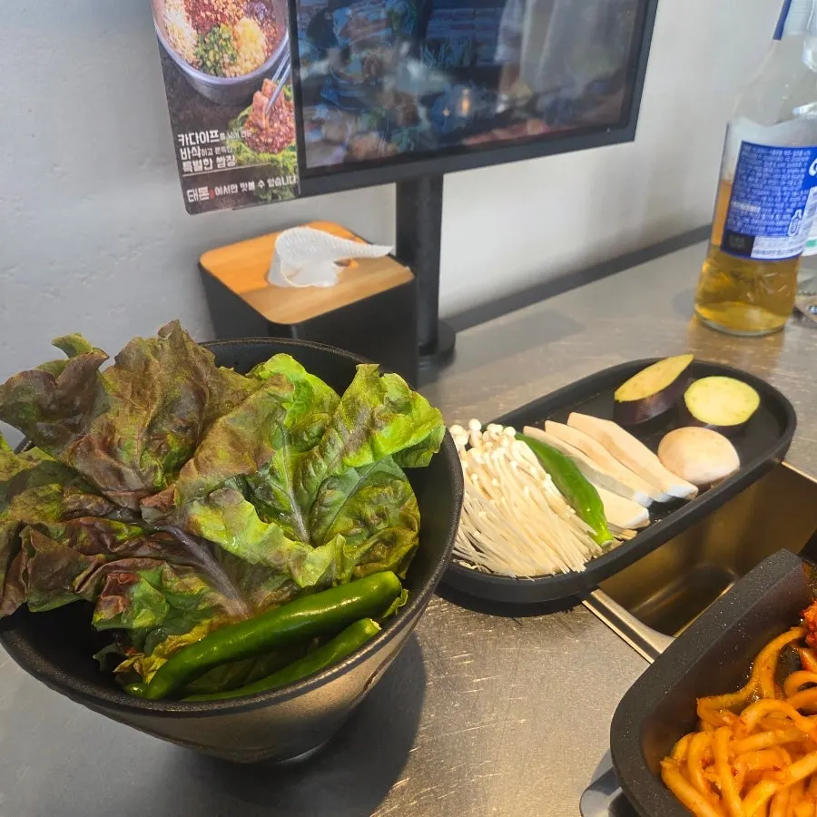 Free tangy-sweet bibim jjolmyeon served as a side