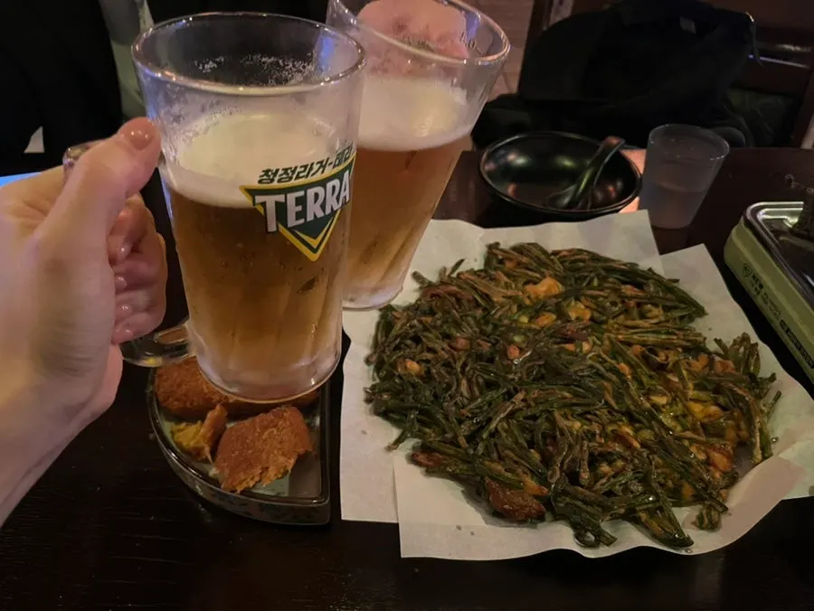 Picking up a piece of squid and chive pancake