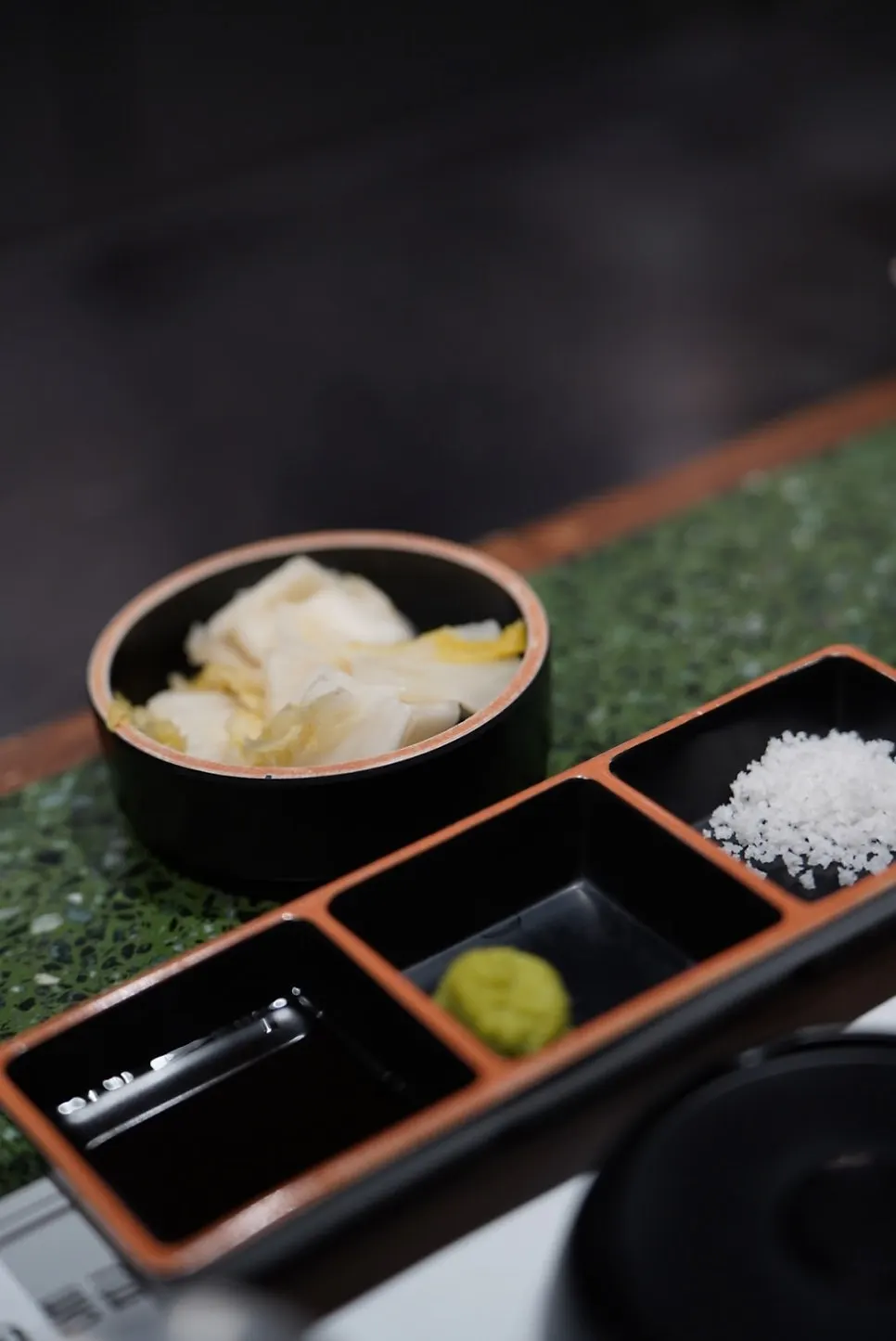 Hanwoo and basic side dishes laid out at the bar table