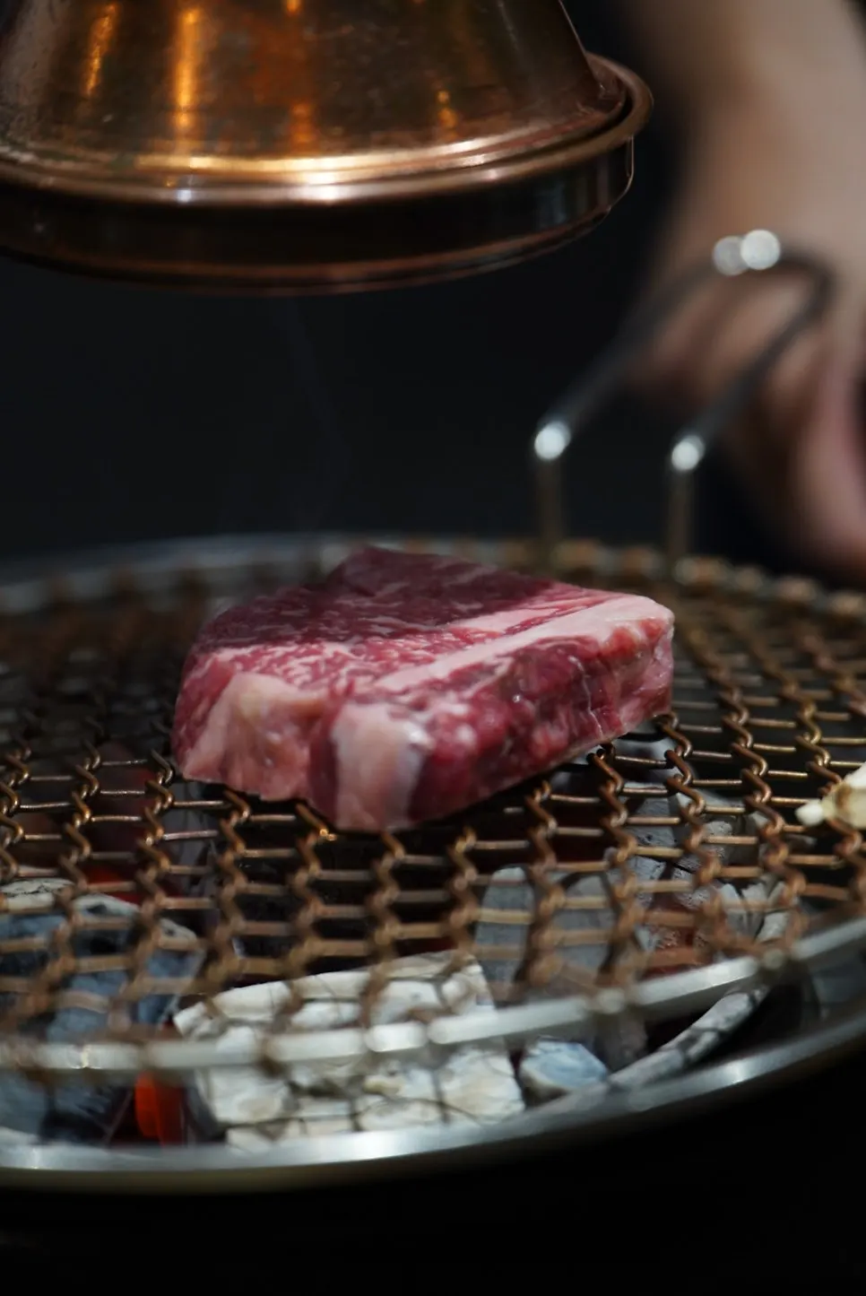 A plate of hanwoo cuts including sirloin and sirloin cap