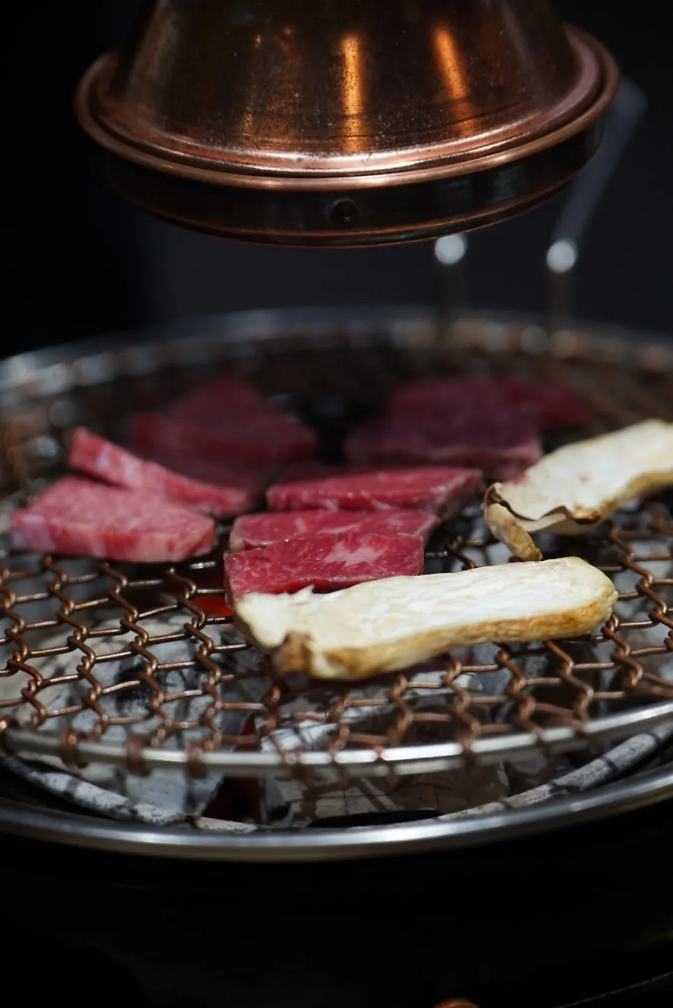 A grilled piece of hanwoo placed on the plate