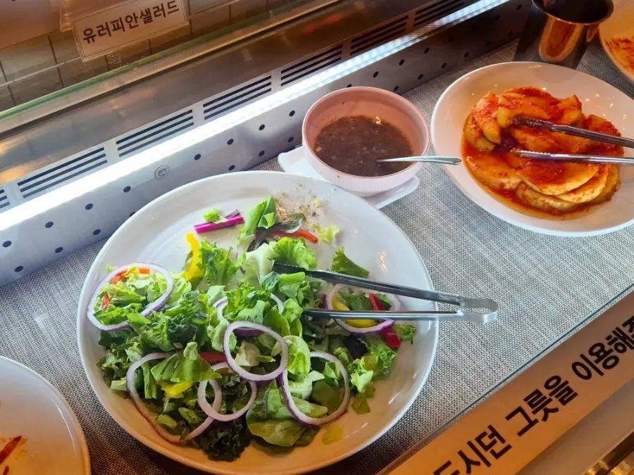 Neatly arranged utensils at the self-serve bar