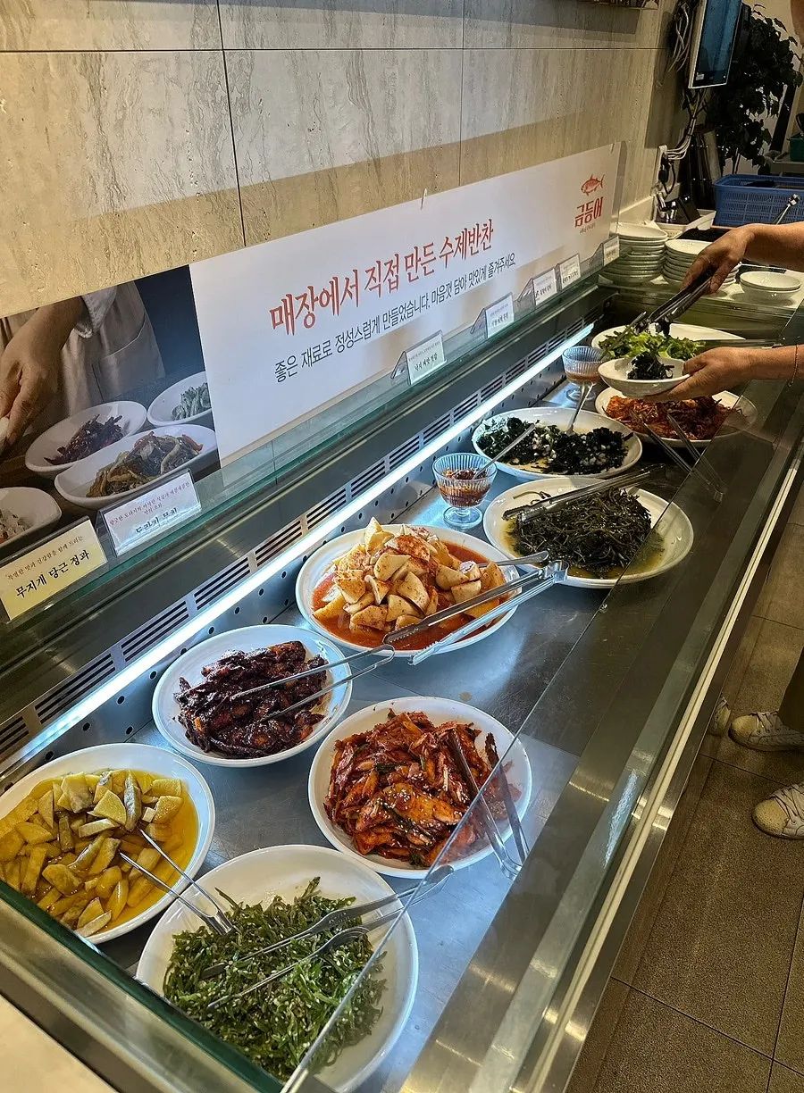 Basic banchan including pickled broccoli and sweet-and-sour eggplant