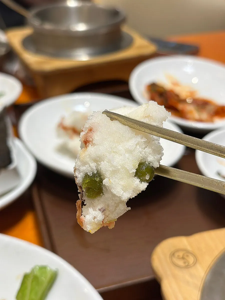 Finishing bowl of sungnyung with kimchi