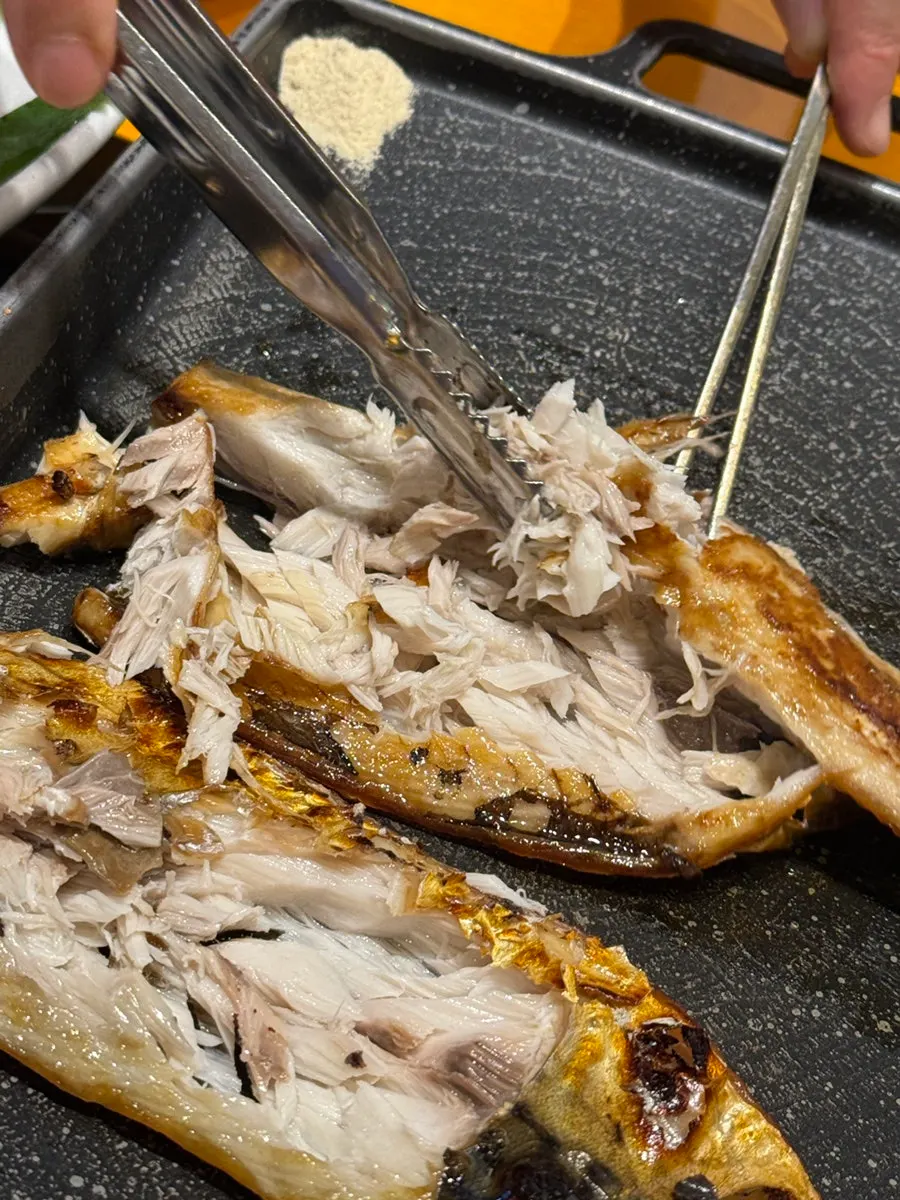 A plump, nicely browned wood-fired grilled mackerel