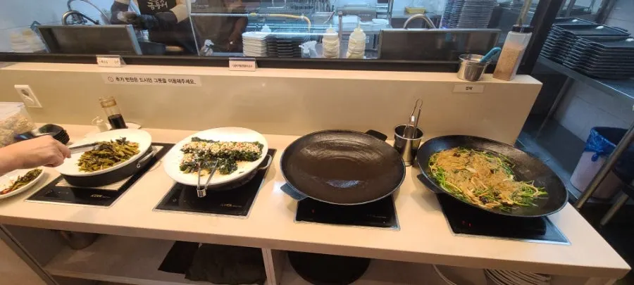 Various banchan laid out at the self-serve bar