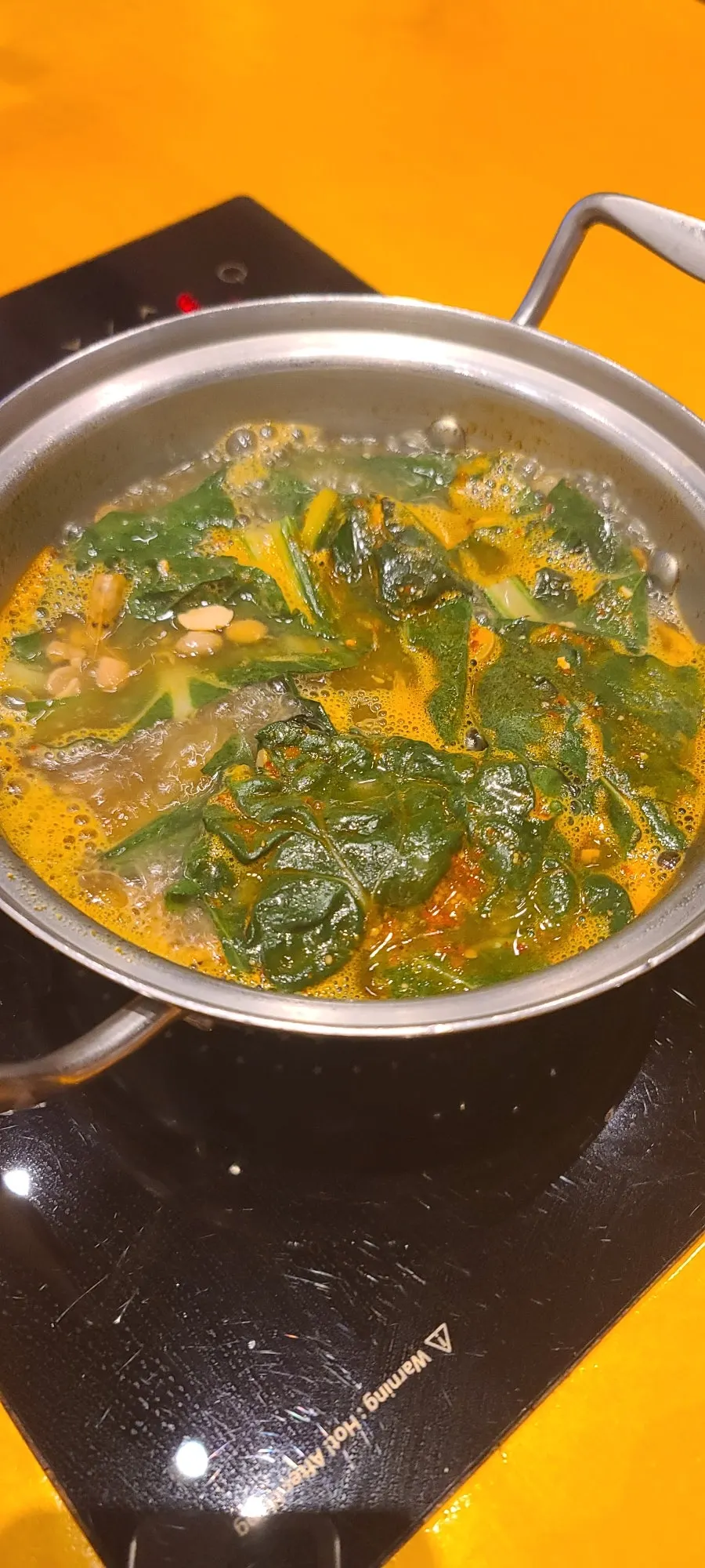 Soup simmering at the table