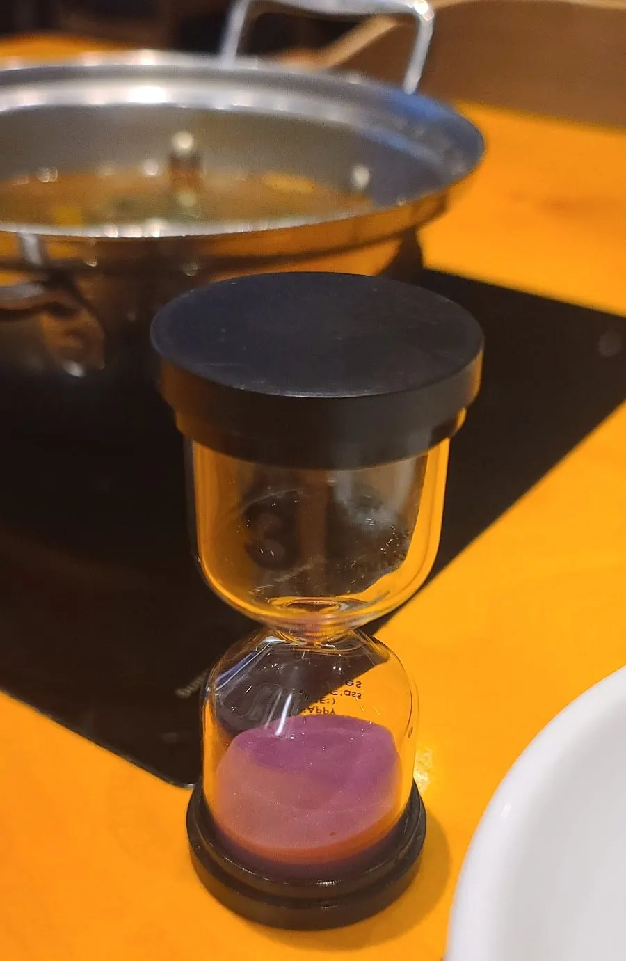 Hourglass used to time the simmering soup