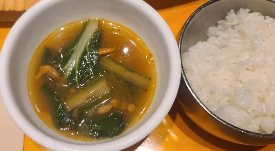 A warm spoonful of soup before the main dish arrives
