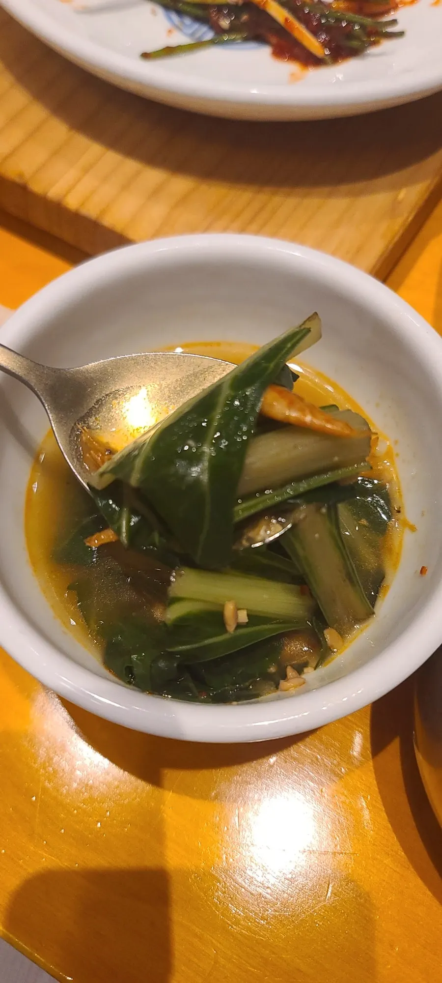 Table set with a spoonful of soup and rice