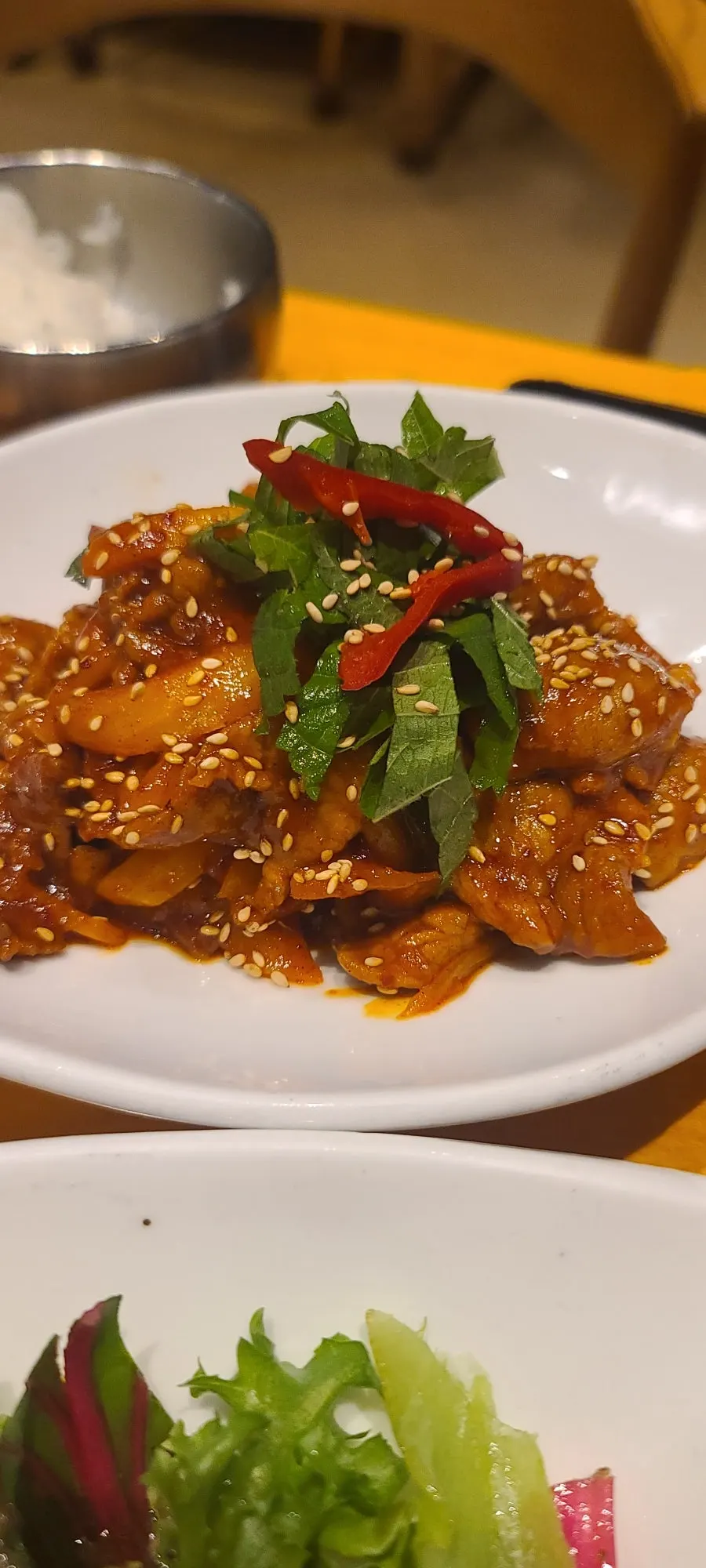 Glossy sauce coating the spicy pork stir-fry