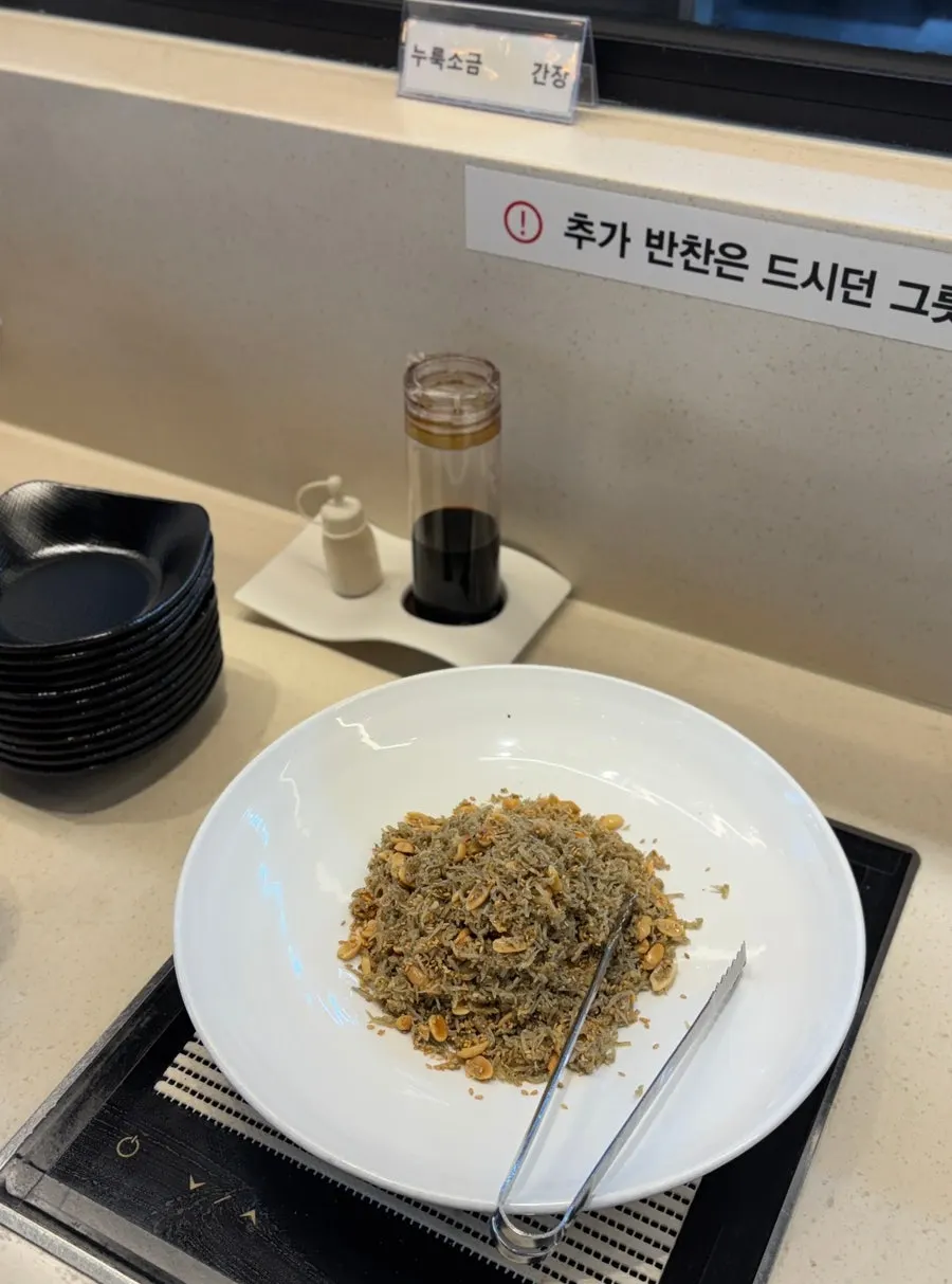 Japchae and gijang seaweed with anchovy sauce at the self-service bar