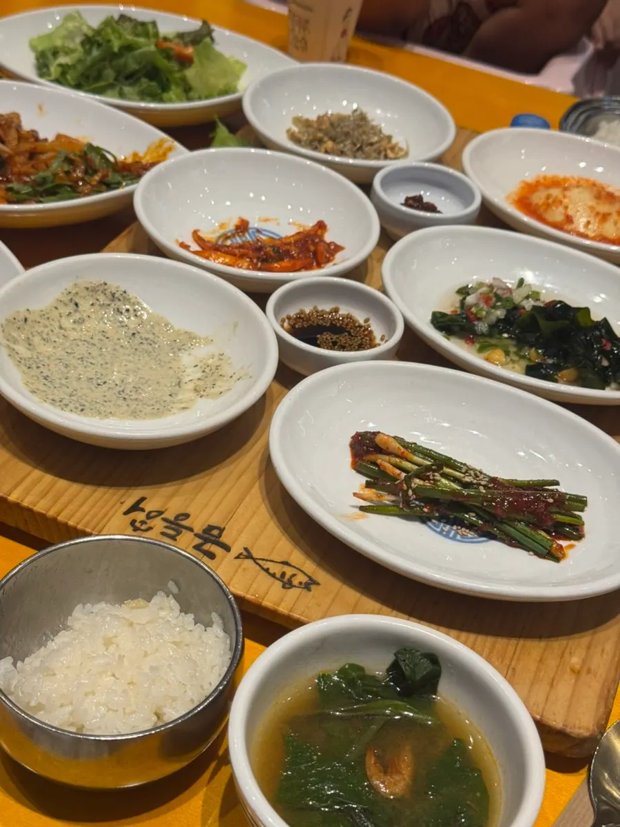 A bite of grilled mackerel with rice