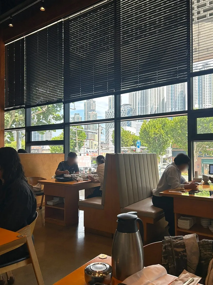 Geumdeungeo's dining hall with high ceilings and full glass windows
