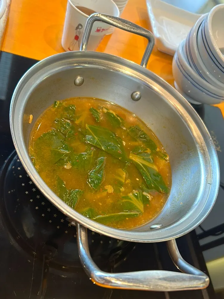 Mallow soybean soup simmering on the induction burner