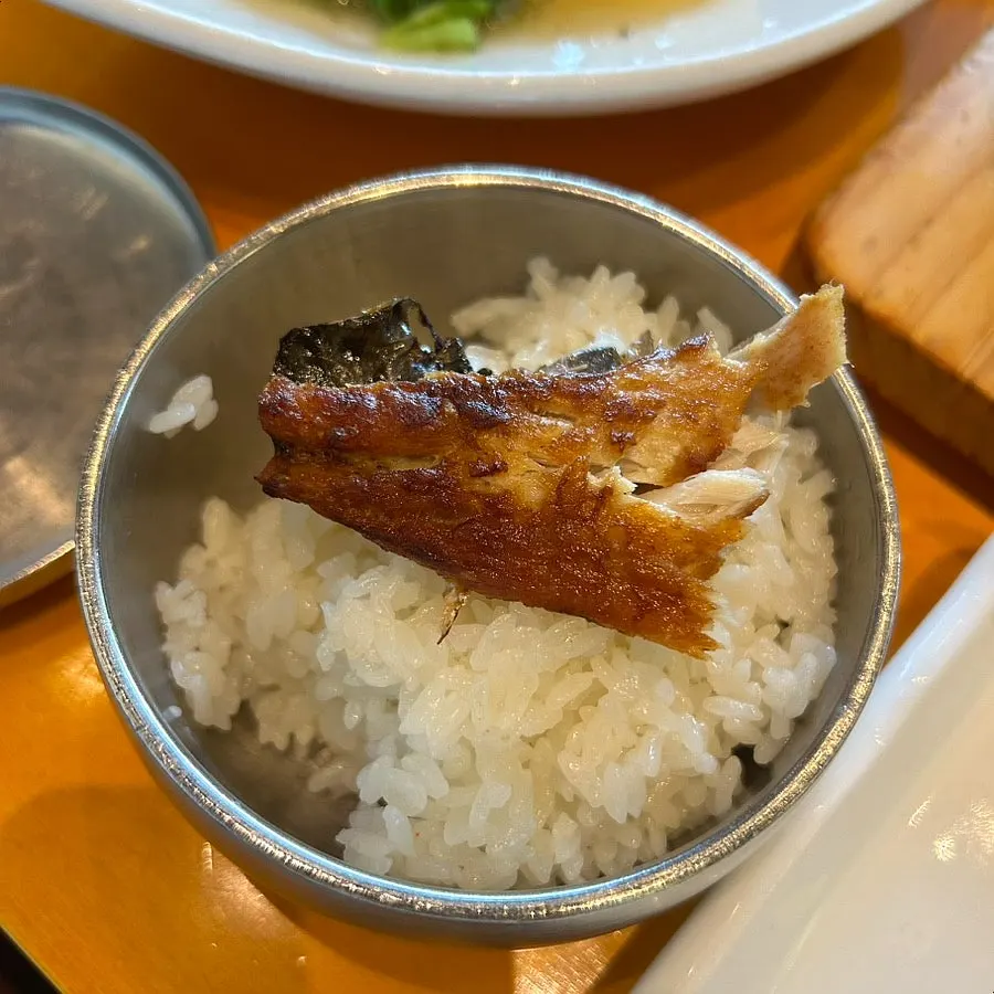 A piece of mackerel set on top of rice