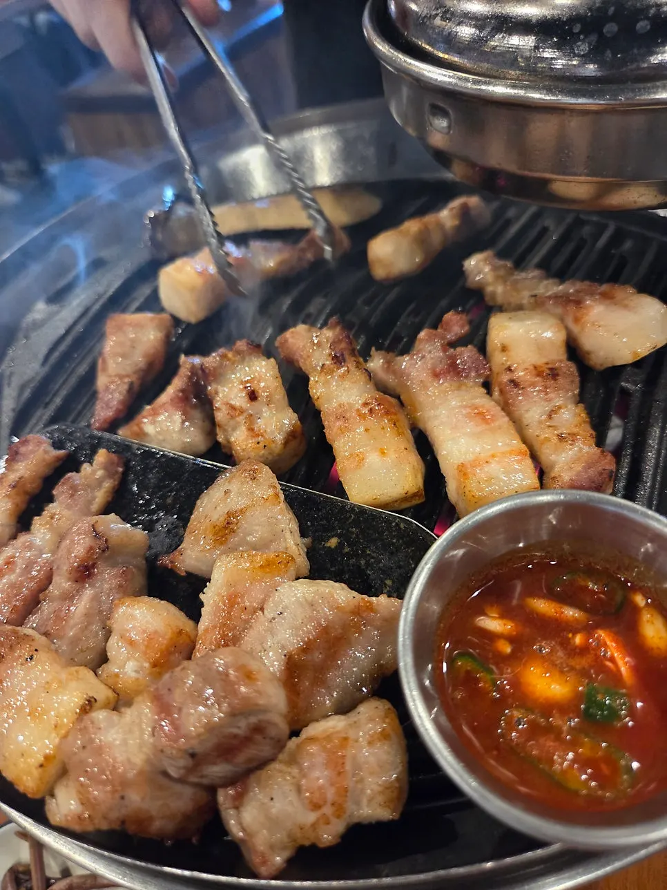 Aged pork belly and pork jowl on the grill