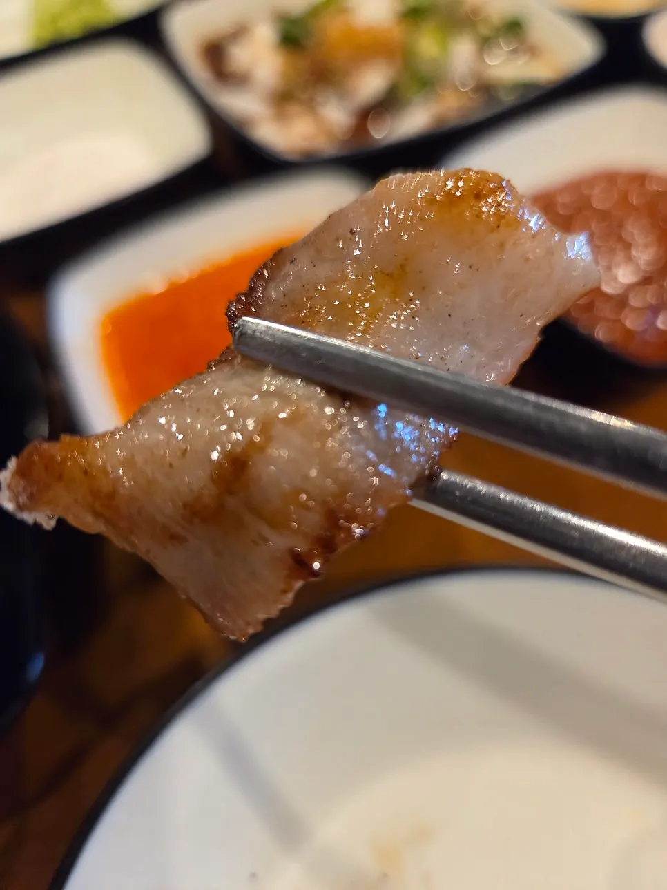 A piece of pork jowl dipped in Himalayan pink salt