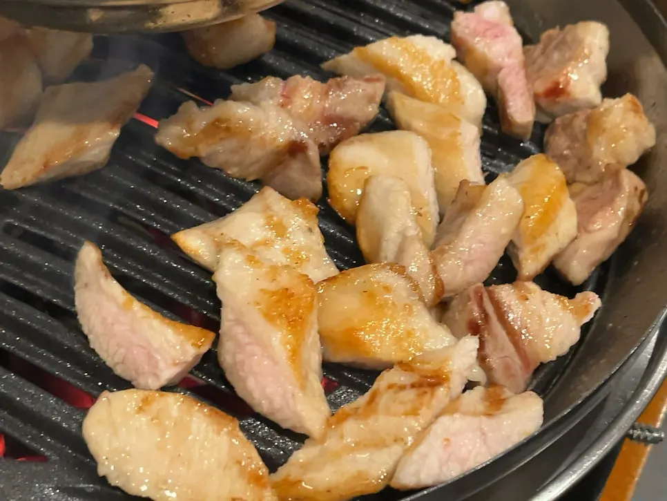 Pork belly browning nicely on the grill