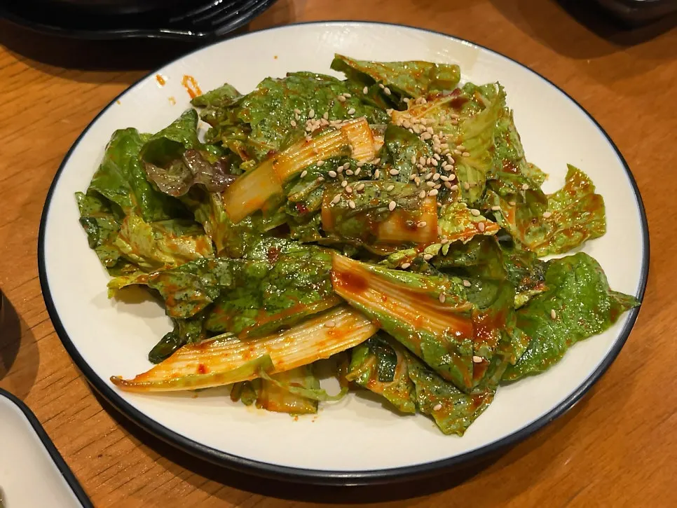 Refilled seasoned vegetables alongside the meat spread