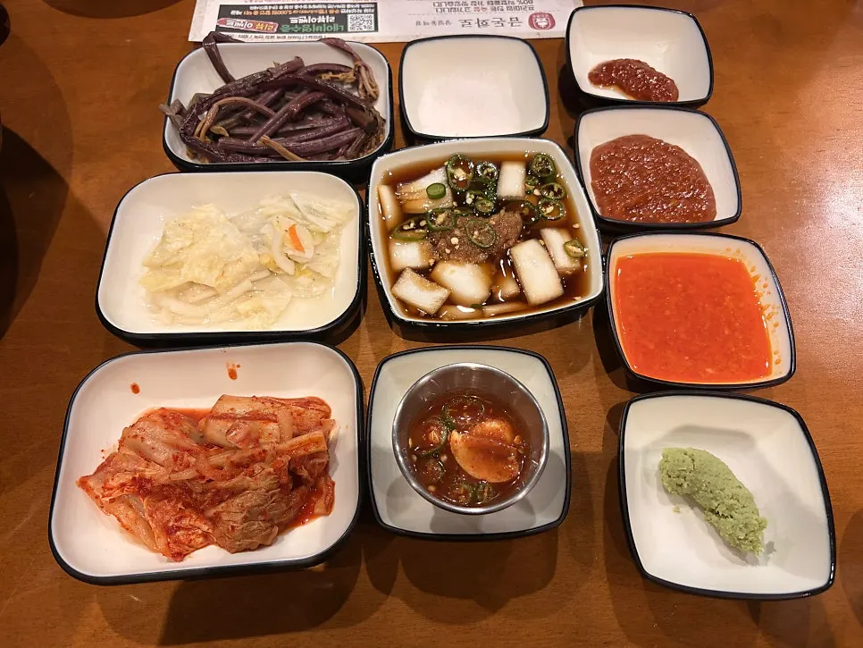 Full spread of banchan set before the meat arrived
