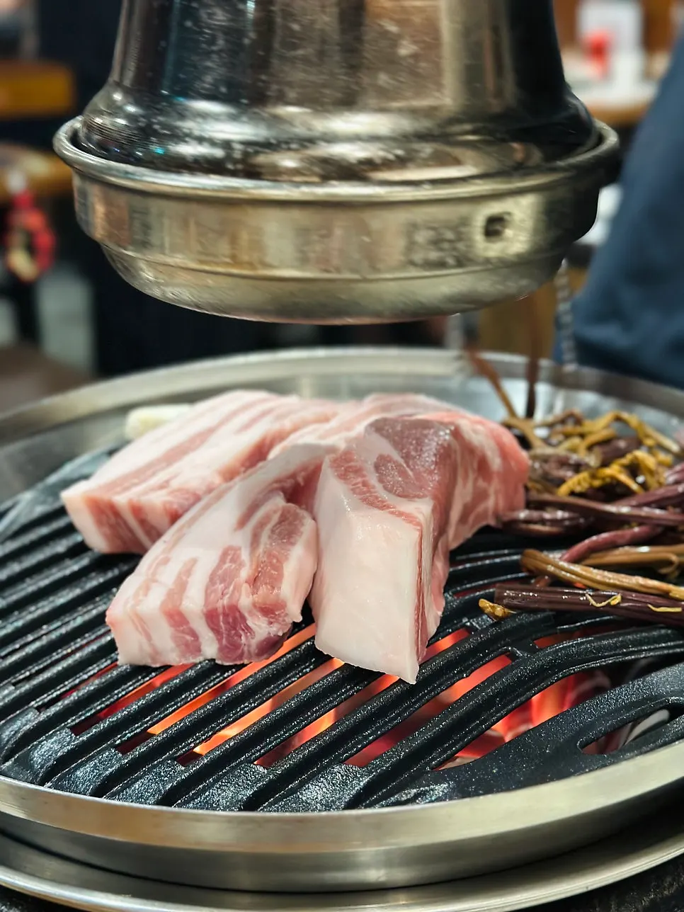 Staff member grilling the meat